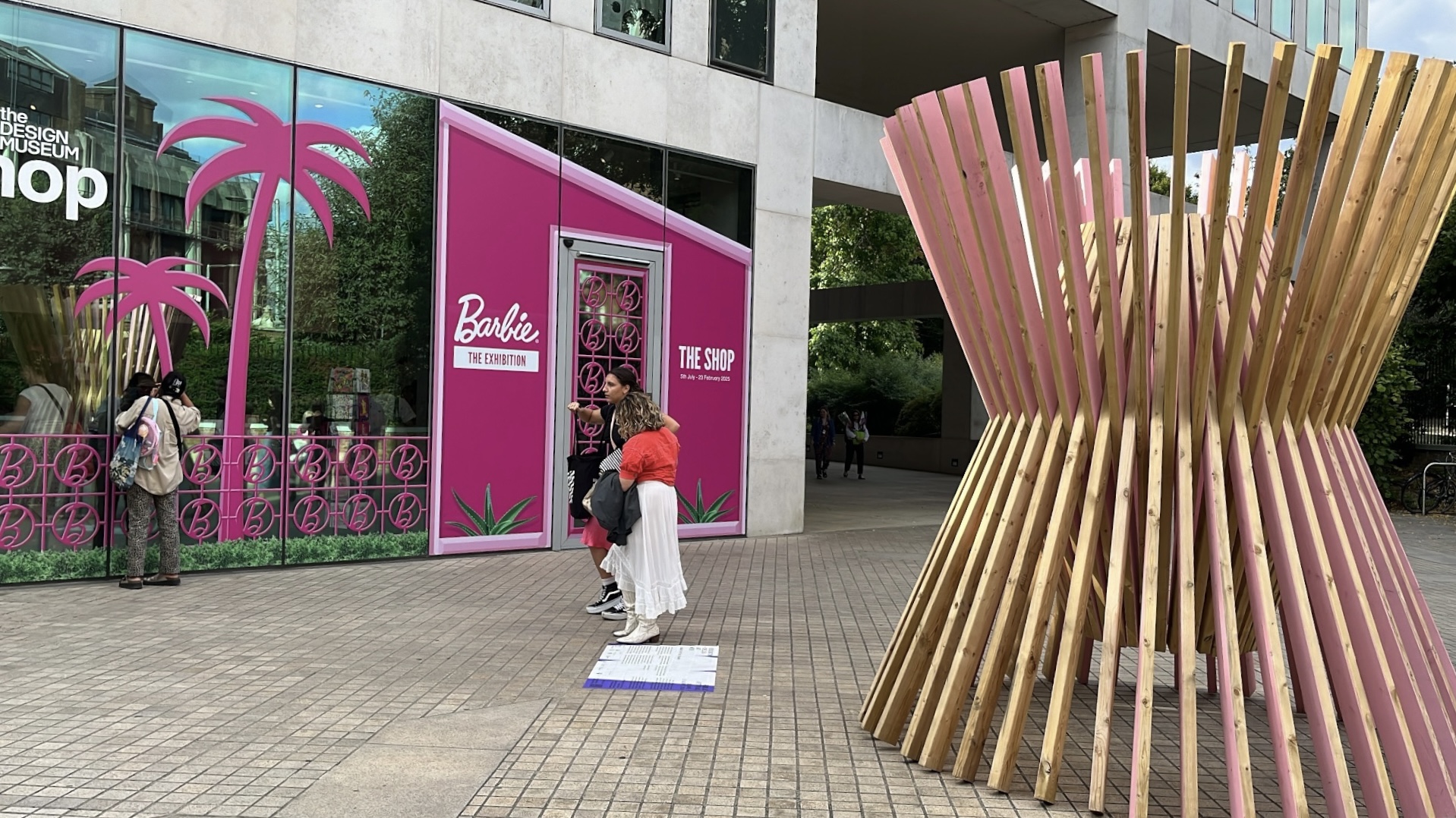 The Design Museum shop transformed into a Barbie-themed store, featuring pink displays, Barbie merchandise, and playful decor inspired by the iconic doll.