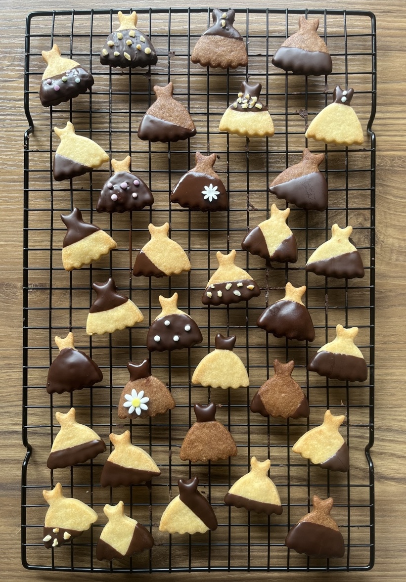 Cookie in dress shape with various chocolate decoration