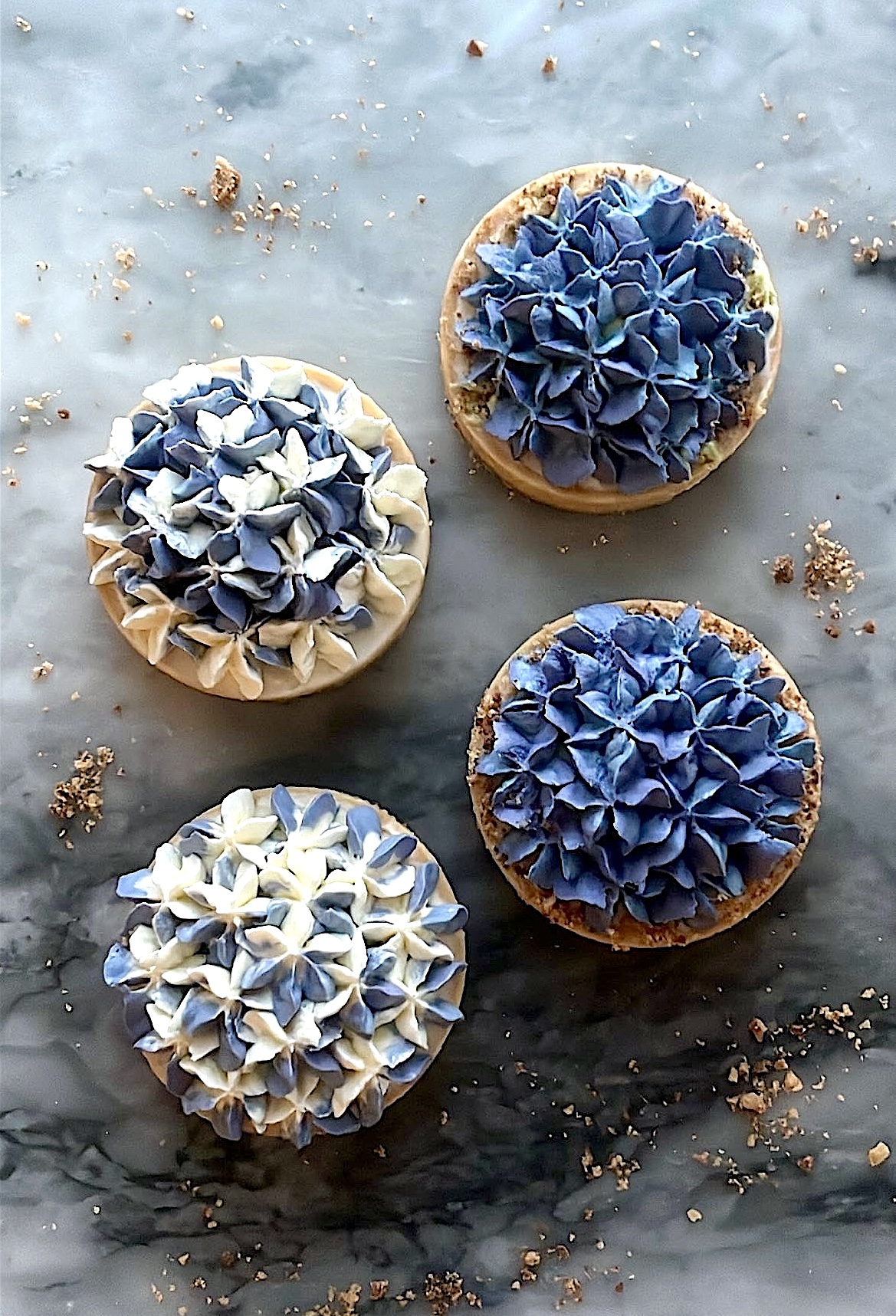 Tart topped with hydrangea-shaped cream decoration in a mix of white and blue colors, linking to the Hydrangea Tart recipe