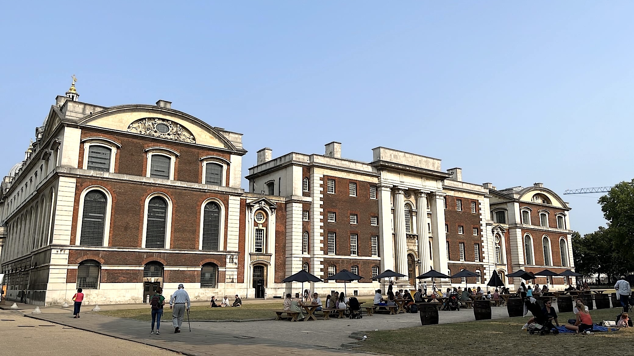 Red-brick building at the Old Royal Naval College in Greenwich, showcasing its historic architecture.