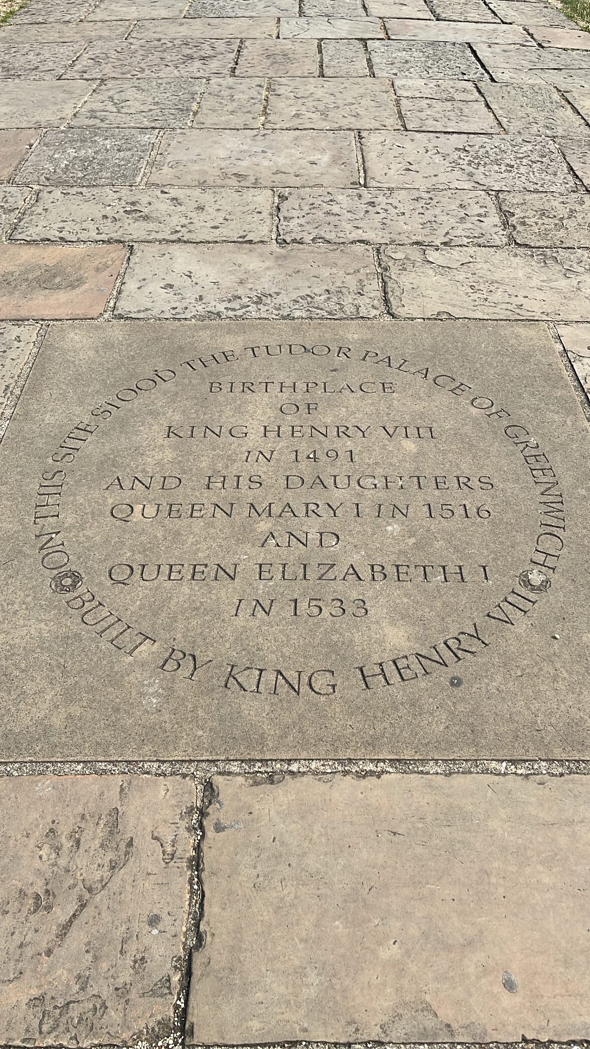 Inscription on the ground marking the birthplace of royal family member at the Old Royal Naval College in Greenwich.