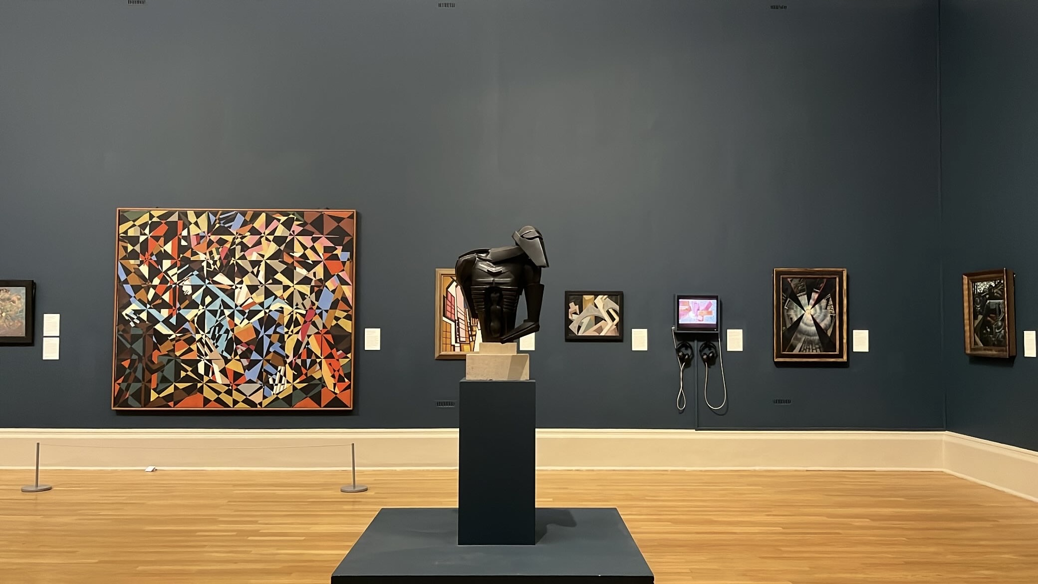 Stylishly designed gallery room in Tate Britain, featuring a minimalist display of carefully curated paintings that emphasize elegance and artistic expression.