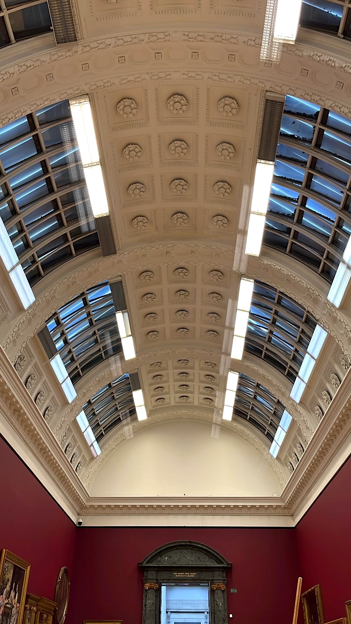 Beautifully designed ceiling of a gallery room in Tate Britain, featuring intricate patterns and artistic details that enhance the elegance of the space.