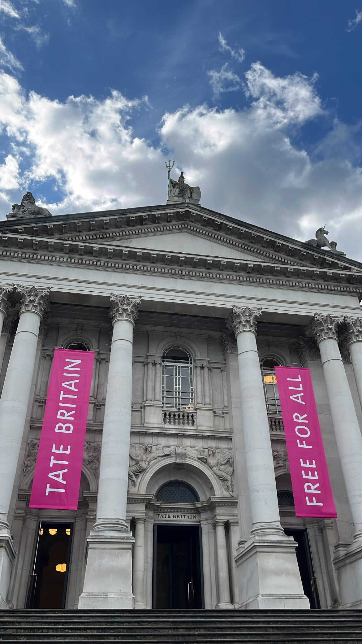 Exterior view of Tate Britain, showcasing its grand architecture and entrance.