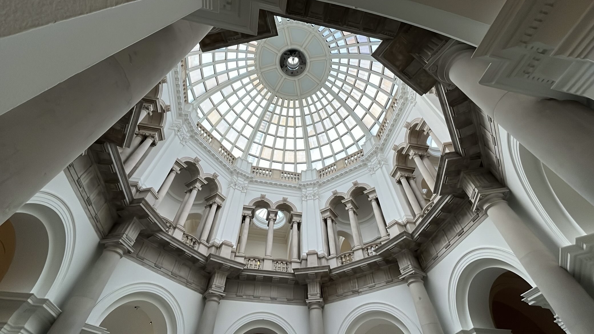 Intricate and richly decorated ceiling of Tate Britain, showcasing elaborate architectural details and craftsmanship as seen upon entering the gallery.